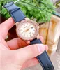 A hand holding a rose gold Casio watch with a black leather strap. Podgląd zdjęcia produktu