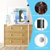 A children's drawing of a penguin in a frame displayed on a dresser. Produktbild-Vorschau