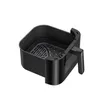A black air fryer basket and handle against a white background. Anteprima dell’immagine prodotto
