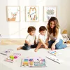 A mother and two young children are playing with educational toys on the floor in a room with artwork on the wall. Produktbild-Vorschau