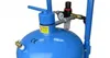 Close-up of a blue sandblasting machine tank with various fittings and a pressure gauge. Produktbild-Vorschau