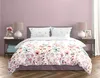 A bed with floral bedding in a bedroom setting. Produktbild-Vorschau