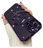 A hand holding a dark purple iPhone case with a MagSafe ring and camera protection. Produktbild-Vorschau