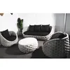 A set of outdoor furniture, including a sofa, two armchairs, and a coffee table, arranged in a room. Produktbild-Vorschau