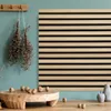 A decorative arrangement of acoustic panels, dried herbs, and decorative objects on a wooden surface against a teal wall. Anteprima dell’immagine prodotto