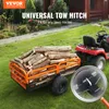 A red lawn tractor is towing a trailer filled with logs. The trailer has an orange frame and black mesh sides. A close-up of the hitch mechanism is shown in a magnified circle. Produktbild-Vorschau