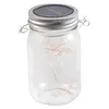 A solar-powered mason jar lantern with fairy lights inside. Produktbild-Vorschau
