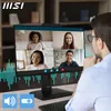 A person is using a computer monitor for a video conference with multiple participants. The monitor displays a video call interface, and there are visual sound wave graphics on the screen and around the monitor. Voir les images du produit