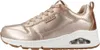 A side view of a single rose gold SKECHERS UNO-METALLIXS sneaker. Voir les images du produit