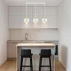 A modern kitchen with a pendant light fixture over a counter. Produktbild-Vorschau