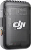 A close-up studio shot of a black and transparent DJI Mic 2 transmitter. Náhled obrázku produktu
