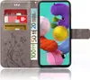 A grey flip case for a Samsung Galaxy A71 phone, showing credit cards and euro banknotes inserted into the case. Produktbild-Vorschau