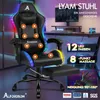 A gaming chair with LED lights and massage features is shown in a room with a desk and computer. Podgląd zdjęcia produktu