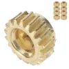 A close-up of a single brass gear with a stack of similar gears in the background. Podgląd zdjęcia produktu
