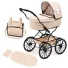 A doll's pram with accessories on a white background. Produktbild-Vorschau