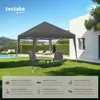 A garden gazebo set up on a lawn with chairs and a table, next to a swimming pool and a modern house. Náhled obrázku produktu