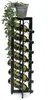 A black metal wine rack holding eight bottles of wine, with a trailing green plant on top. Náhled obrázku produktu