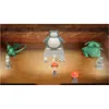 A scene from the video game Pokemon Brilliant Diamond, showing various Pokemon statues and a character in a cave-like setting. Produktbild-Vorschau