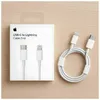 A white box with Apple branding and product information sits next to a coiled white USB-C to Lightning cable on a light brown wooden surface. Produktbild-Vorschau