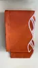 A folded orange awning valance with a white scalloped trim is displayed against a white background. Produktbild-Vorschau