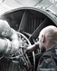 A mechanic is working on a jet engine. Produktbild-Vorschau