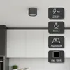 A modern kitchen with white cabinets and a ceiling light fixture. Podgląd zdjęcia produktu