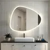 A modern bathroom vanity with a rectangular sink and an irregularly shaped LED mirror above it. Produktbild-Vorschau
