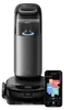 A robot vacuum cleaner with its charging/emptying station and a smartphone displaying its app interface. Náhled obrázku produktu