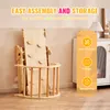 A wooden Pikler triangle climber folded for storage, with marketing text overlays highlighting its features. Voir les images du produit
