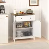 A white sideboard cabinet with a wooden top, open doors revealing shelves with plates, jars, and a pot. A green toaster and fruit bowl are on top. Produktbild-Vorschau