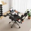 An ergonomic office chair with a laptop workstation attached, set up in a well-lit room with sheer curtains and a plant. Náhľad obrázku produktu