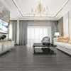 A modern living room with a TV, sofa, coffee table, and a large window with curtains. Produktbild-Vorschau