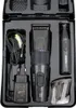 A black case containing a hair and beard trimmer set, including the main trimmer, a nose trimmer, a charging cable, a power adapter, and comb attachments. Anteprima dell’immagine prodotto