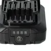 A close-up view of the top part of a black battery pack, showing the connection terminals and a battery indicator with a charging symbol. Produktbild-Vorschau