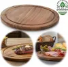 A collage showing a wooden serving board, a steak with butter and rosemary, and a charcuterie board with bread, cheese, and pickles. Produktbild-Vorschau