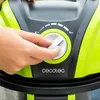 A hand is shown adjusting a dial on a green and black appliance. Anteprima dell’immagine prodotto