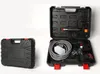 A black carrying case for a pressure washer is shown open, revealing the pressure washer and its accessories, next to a closed carrying case. Podgląd zdjęcia produktu