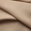 A close-up view of folded taupe fabric, likely a curtain. Náhľad obrázku produktu