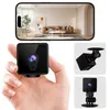 A hand holding a mini camera, with a smartphone displaying a live feed from the camera and additional product shots. Produktbild-Vorschau