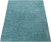 A teal shaggy rug is shown from a slightly elevated angle against a white background. Produktbild-Vorschau