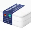 A white mattress with a blue label wrapped around it, showing product details and certifications. Produktbild-Vorschau