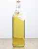 A clear shot of a bottle of liquid on a wooden surface against a white background. Produktbild-Vorschau