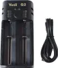 A black dual battery charger with a black USB cable next to it, on a white background. Produktbild-Vorschau