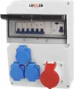 A white electrical distribution box with multiple outlets and circuit breakers. Produktbild-Vorschau