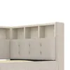 A close-up view of a beige upholstered bed frame with built-in shelving at the headboard. Produktbild-Vorschau