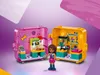 A LEGO Friends Andreas magical cube playset, designed as a pet shop, is displayed open with a mini-doll figure in front. Náhled obrázku produktu