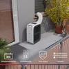 A portable air conditioner unit is shown on a balcony, connected to a window with an exhaust hose. The image includes marketing icons and text detailing product features. Produktbild-Vorschau
