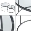 Collage of close-up and full shots of a set of two round nesting coffee tables with metal frames and glass tops. Produktbild-Vorschau