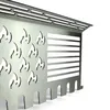 A close-up, angled view of a stainless steel grill accessory with flame cutouts and a slatted section. Podgląd zdjęcia produktu