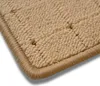 A close-up view of the corner of a beige carpet runner. Produktbild-Vorschau